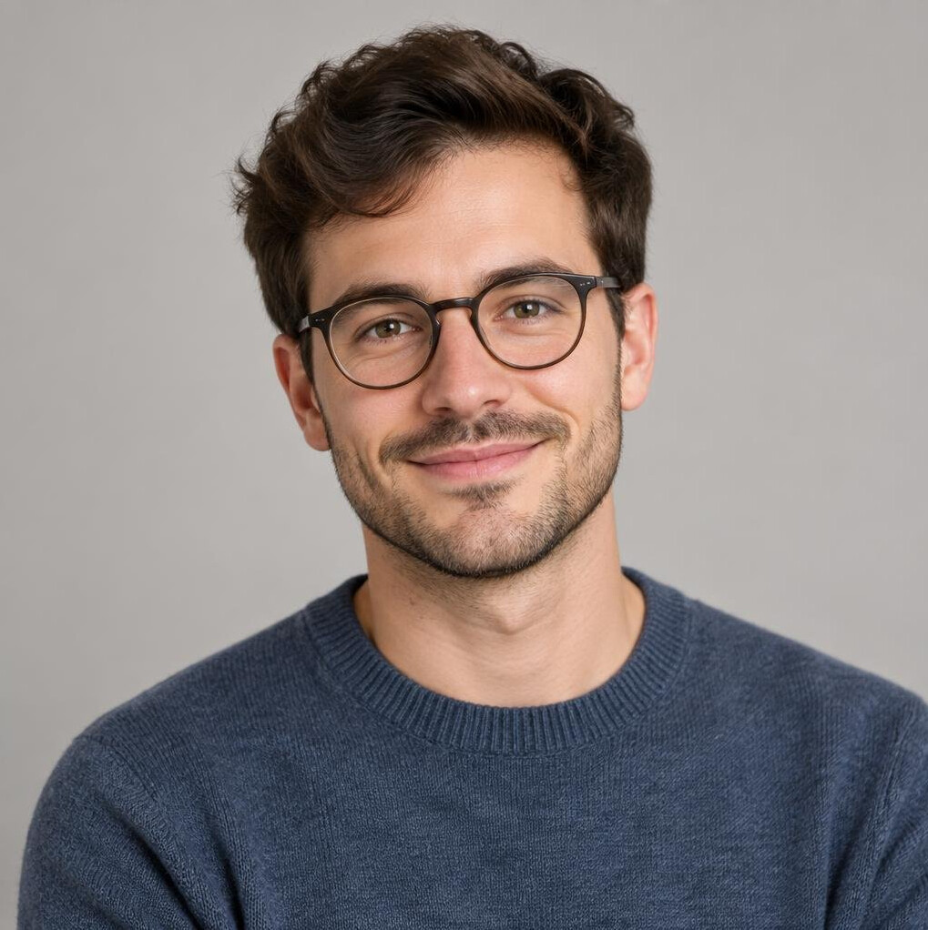 Studio portrait of a young swiss man with glasses