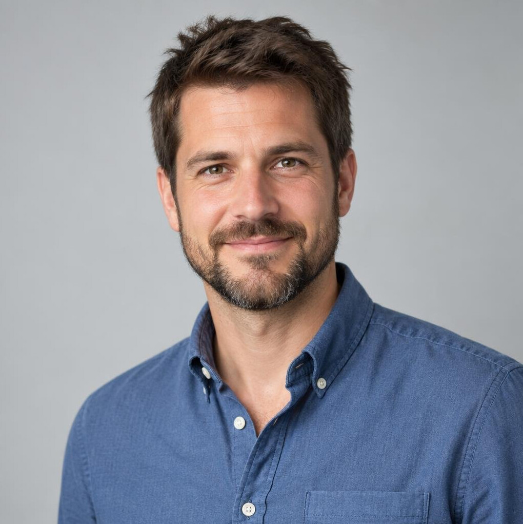 Studio portrait of a swiss man with short beard and casual shirt